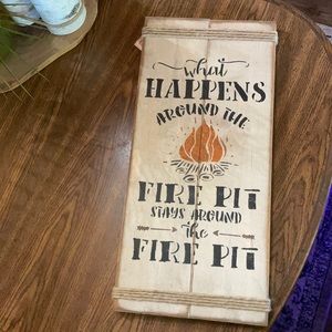 What happens around the fire pit sign